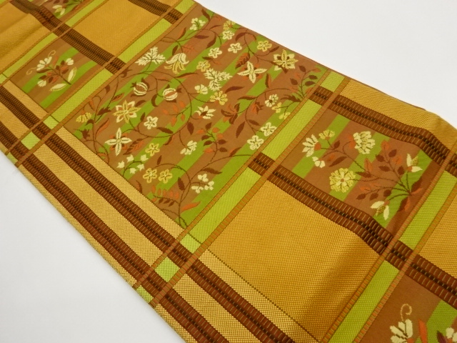 Nagoya obi woven with plaid, stripes, and floral arabesque pattern
